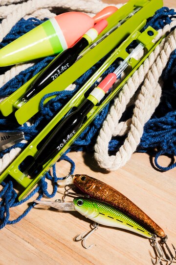 fishing-bait-fishing-line-fishing-float-wooden-surface_23-2148189305