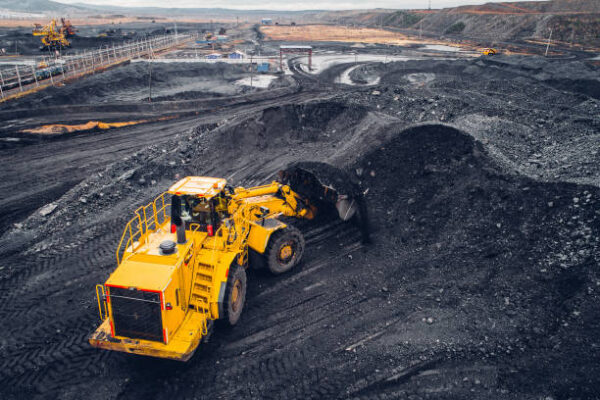 Coal mining at an open pit from above.